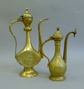 Two Persian brass teapots. The largest 37 cm high.