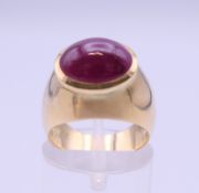 An 18 ct gold cabochon ruby set ring. Approximately 4.5 carats. Ring size K. 11.