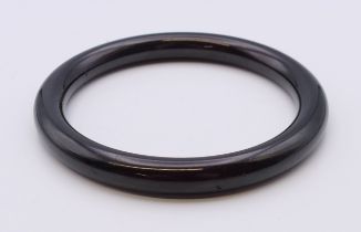 A bangle. Approximately 6.5 cm internal diameter.