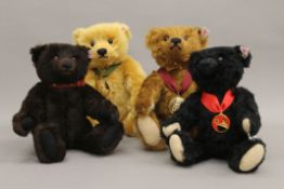 Four Steiff teddy bears, each housed in a Steiff display case - 2011 Bear of the Year,