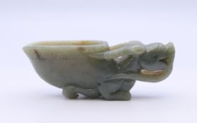A jade libation cup. 9 cm long.