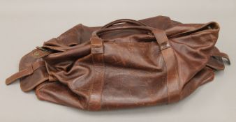 An Agustino leather bag. 55 cm long.
