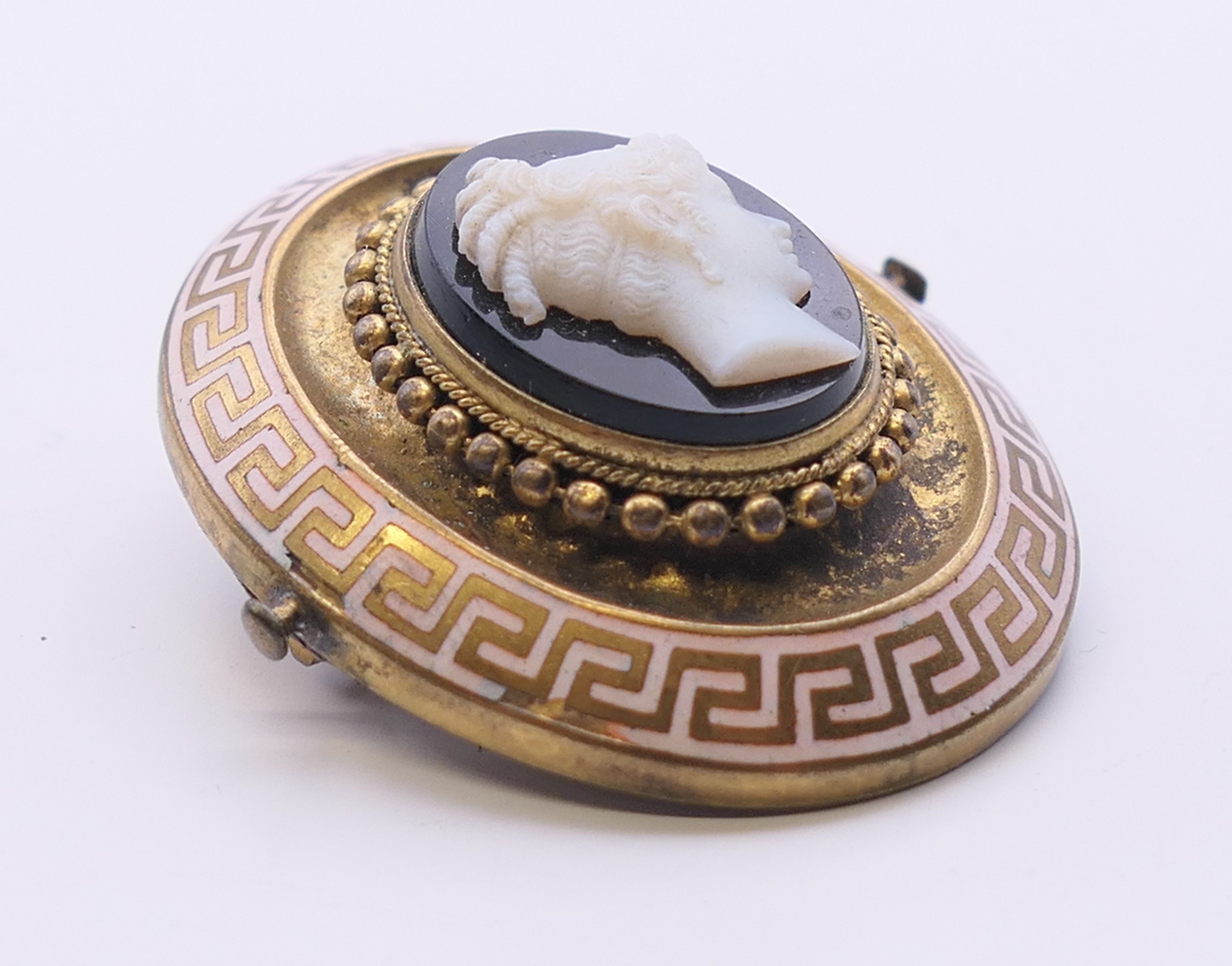 A Victorian enamel and cameo set mourning brooch. 4 cm high. - Image 2 of 3