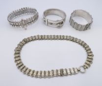 An unmarked silver bangle form bracelet, another silver bracelet,