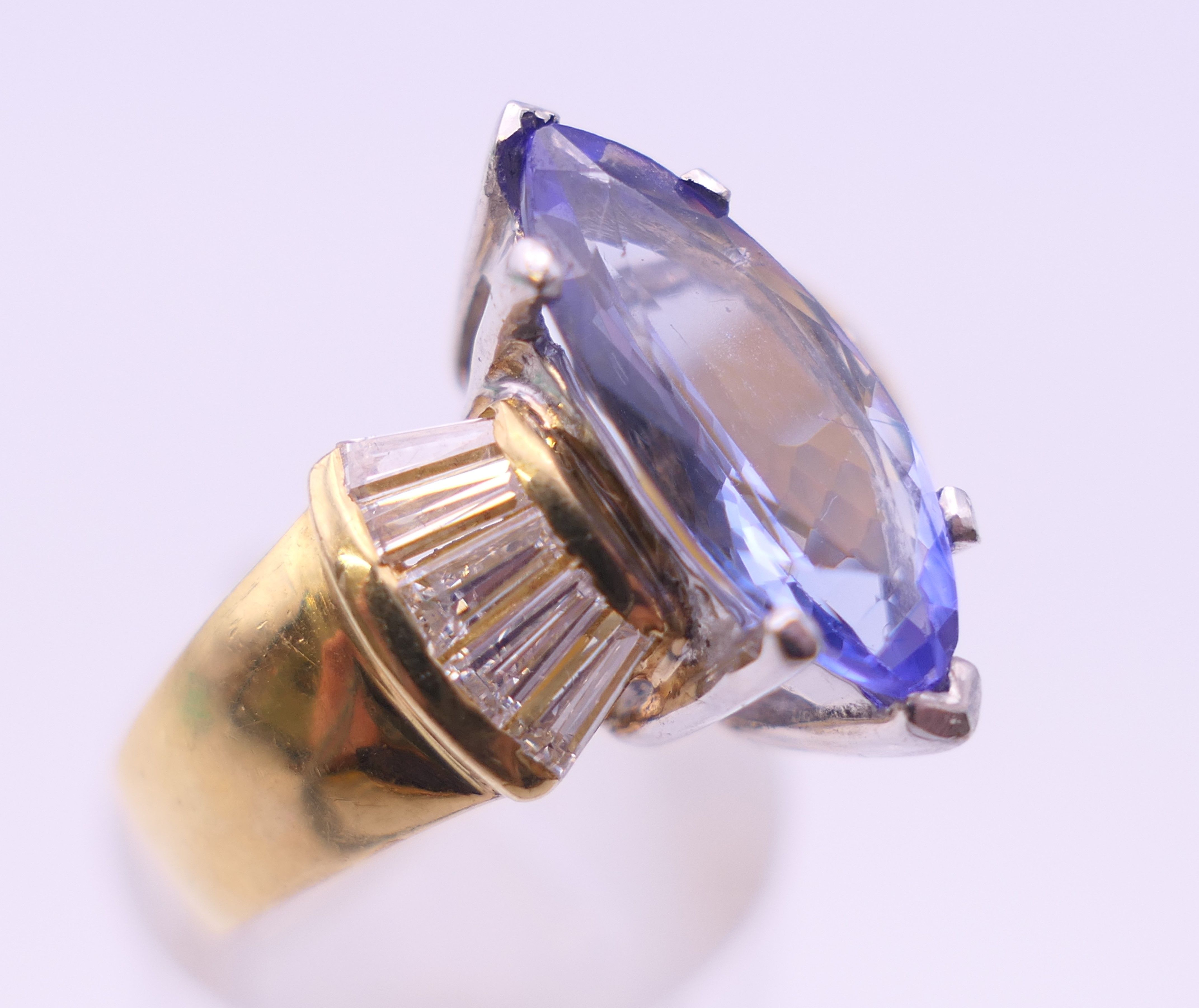 An 18 ct gold tanzanite and baguette diamond ring. Ring size O/P. - Image 6 of 8