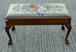 An early 20th century duet piano stool with tapestry seat. 100 cm long.