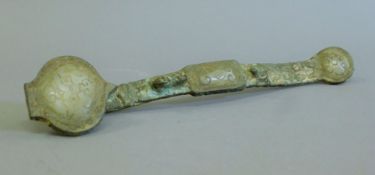 An archaic style bronze and jade ruyi sceptre. 30 cm long.