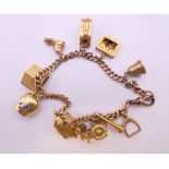 A 9 ct gold charm bracelet (house charm 18 ct gold). 17 cm long. 31.4 grammes total weight.