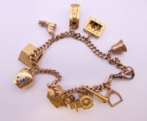 A 9 ct gold charm bracelet (house charm 18 ct gold). 17 cm long. 31.4 grammes total weight.