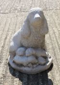 A garden ornament formed as a spaniel and a puppy. 34 cm high.