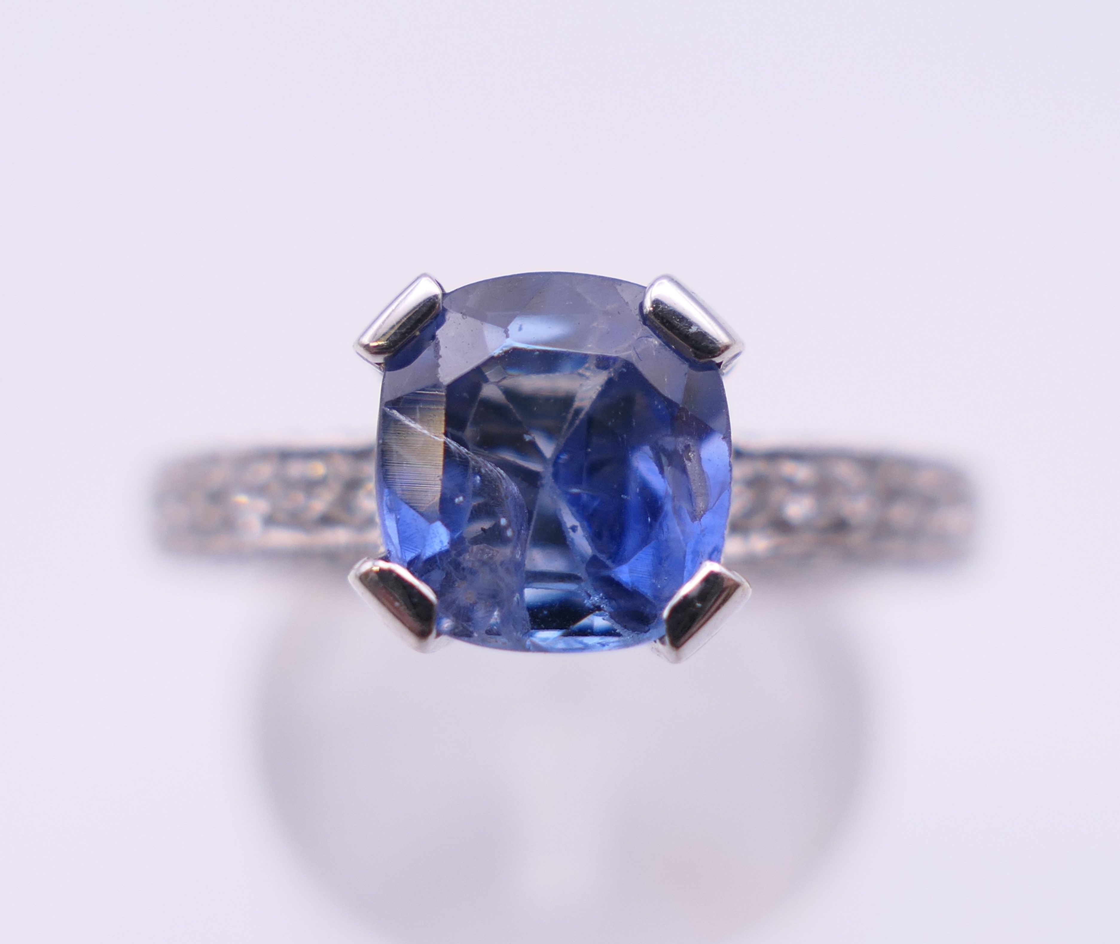 An 18 ct gold sapphire and diamond ring. Total diamond weight approximately 2.5 carats. - Image 3 of 11