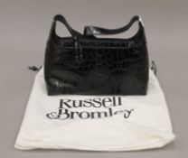 A Russell & Bromley (Stuart Weissman) black bag, in dust bag. 26 cm wide.