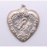 A large sterling silver heart pendant. 9 cm high.