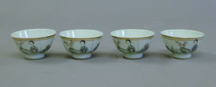 Four Chinese porcelain tea bowls. 6.25 cm diameter.