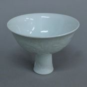 A Chinese white porcelain stem cup. 11 cm high.