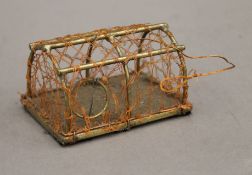 A miniature brass lobster pot. 8.5 cm long.