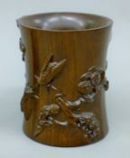 A Chinese carved wooden brush pot. 12.5 cm high.