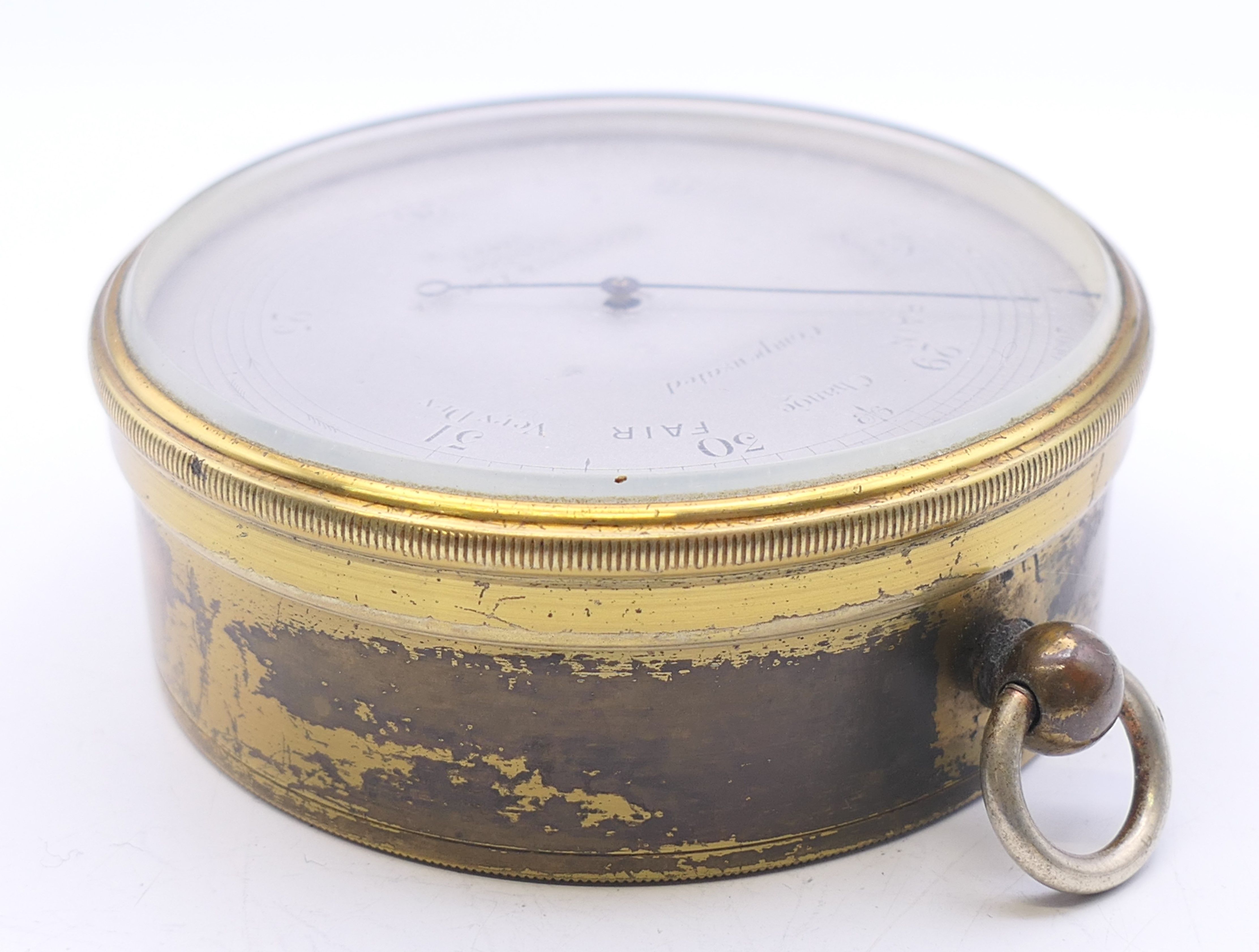 A Negretti & Zambra of London brass barometer, in original case, numbered 17423. 7 cm diameter. - Image 6 of 15