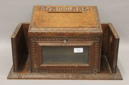 A Victorian carved oak hall letter box. 51.5 cm wide.
