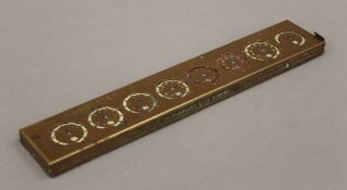 A Taylor's addometer. 29 cm long.