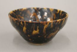 A Chinese tortoiseshell glazed bowl, Song Dynasty. 10.5 cm diameter.