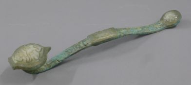 A bronze and jade ruyi sceptre. 30 cm long.