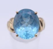 A 9 K gold ring set with a Swiss blue topaz stone, with certification. Ring size N. 7.