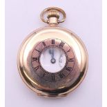 A rolled gold half hunter pocket watch, case marked Star Dennison and numbered 186467.