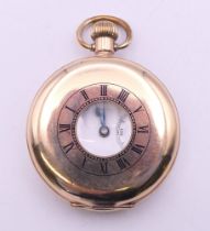 A rolled gold half hunter pocket watch, case marked Star Dennison and numbered 186467.