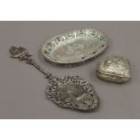A Dutch silver heart shaped box, a small silver tray and a silver spoon. The former 6.5 cm wide.