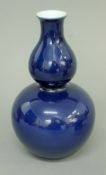 A Chinese porcelain blue double gourd vase. 21.5 cm high.