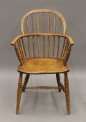 A 19th century elm seated Windsor chair. 56.5 cm wide.