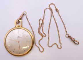 An 18 ct gold Bucherer open face pocket watch on a 9 ct gold chain. 4.25 cm diameter. The watch 38.