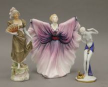 A Royal Doulton figurine, a Royal Dux figurine and another Art Deco figurine. The former 20 cm high.