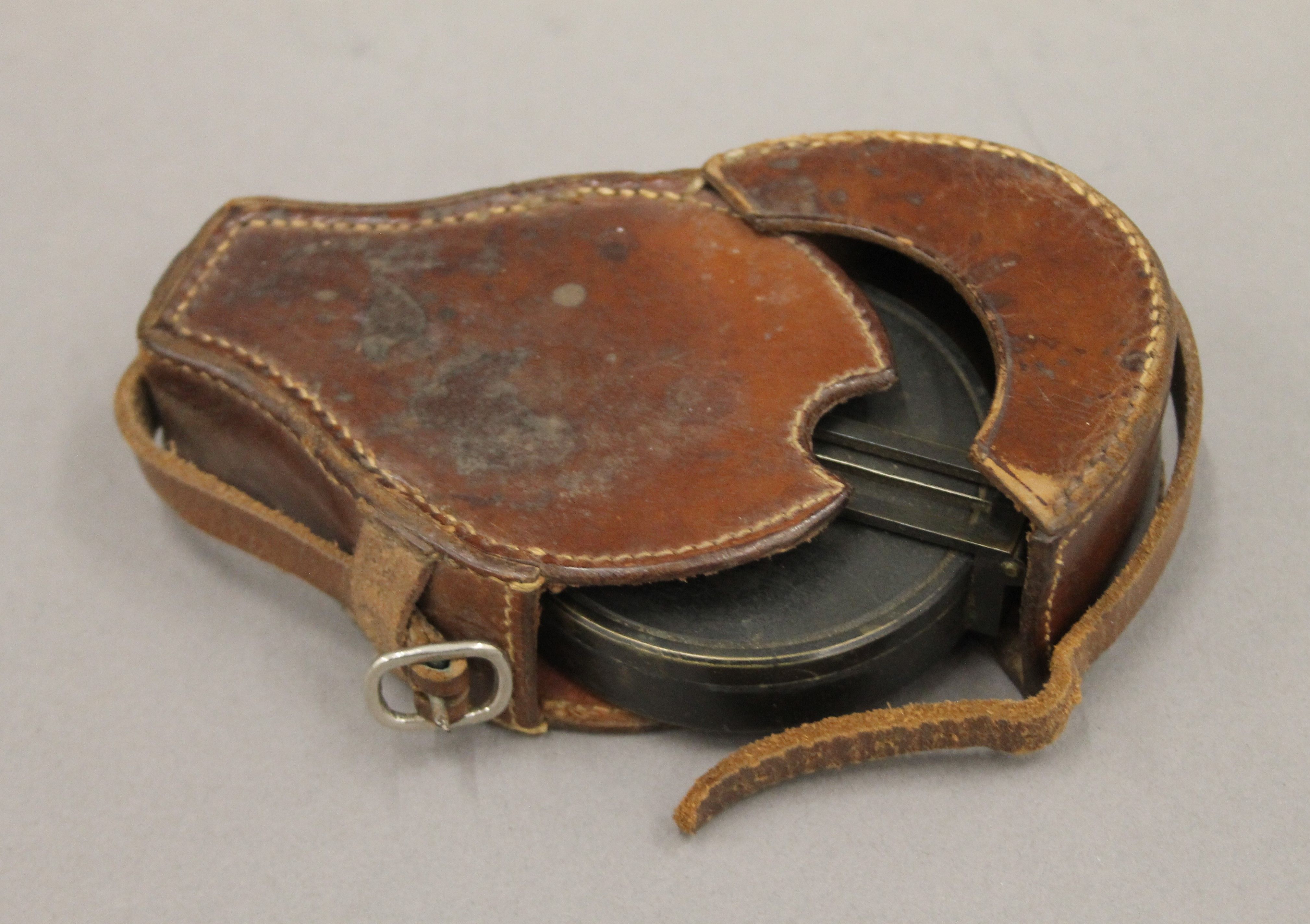 A leather cased military compass. 7 cm diameter. - Image 6 of 7