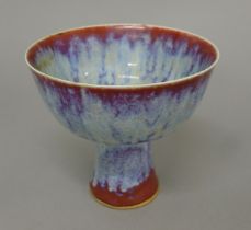 A Chinese red and blue splash porcelain stem cup. 13 cm high.