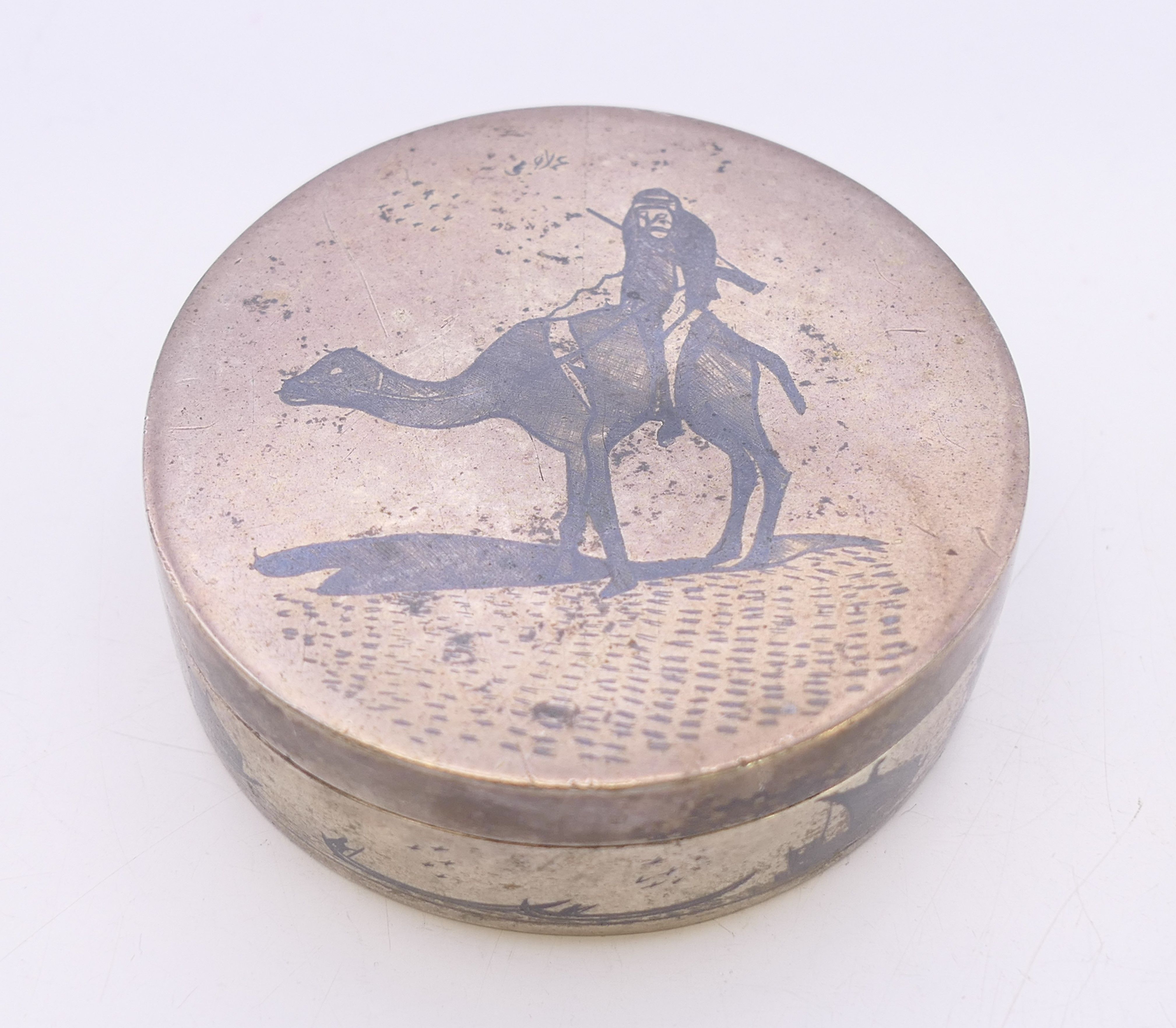 An Egyptian silver box. 6.5 cm diameter. 96.1 grammes.