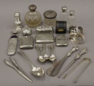 A quantity of silver and silver mounted items, including cigarette cases, dressing table jars,