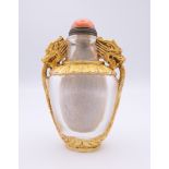 A Chinese gilded glass snuff bottle decorated with dragons. 8.5 cm high.