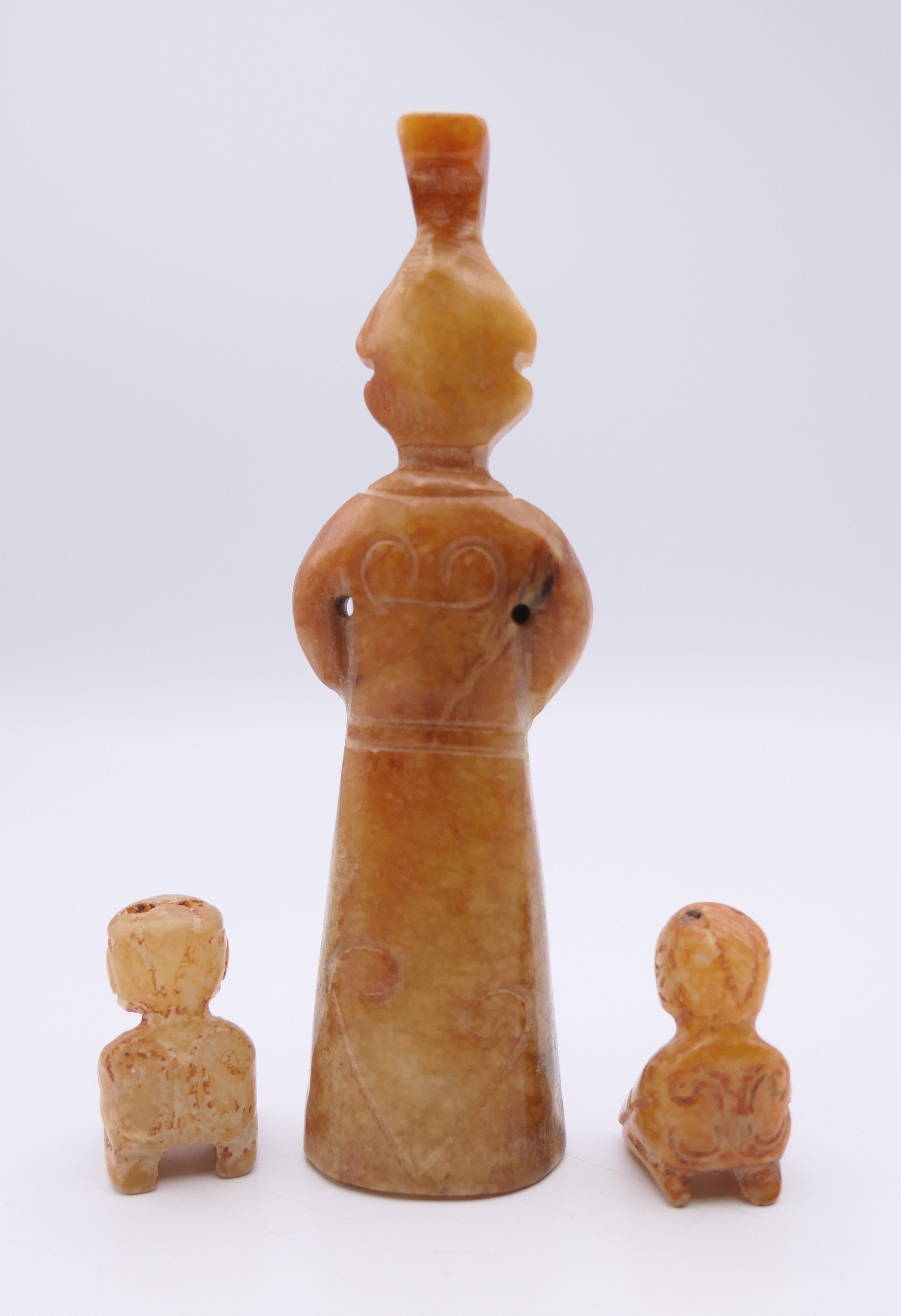 A Chinese jade standing male figure, together with two smaller kneeling male figures, Han Dynasty. - Image 2 of 11