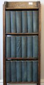 A collection of Charles Dickson volumes, housed in an oak bookcase. 33.5 cm wide.