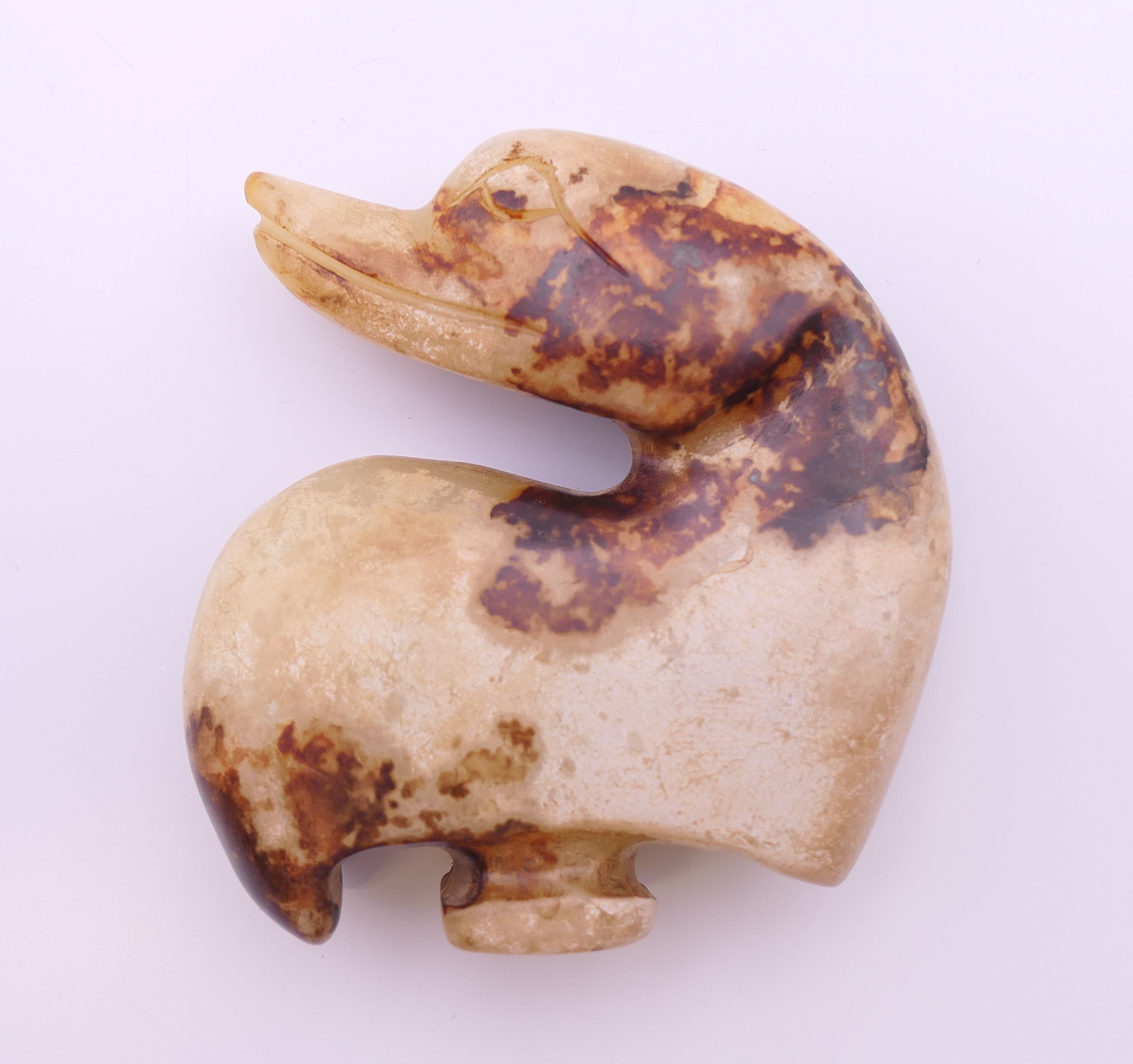 A Chinese off white and brown jade duck belt hook, Ming Dynasty. 5.5 cm high. - Image 2 of 7