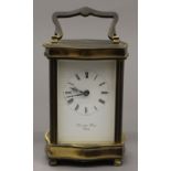 A brass cased carriage clock. 15 cm high.