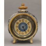 A Doulton Lambeth stoneware clock by Emily Welch. 18 cm high.