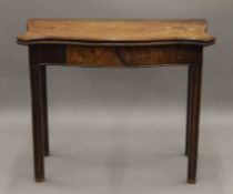 A 19th century mahogany Serpentine fold over tea table. 90.5 cm wide.