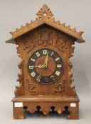 A Victorian oak cuckoo clock. 55 cm high.