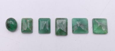 Six loose emeralds. The largest approximately 9 mm long.