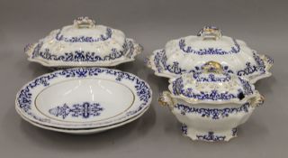 A quantity of Victorian gilt heightened blue and white porcelain table wares.