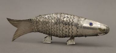 An 800 silver articulated model of a fish. 21 cm long.