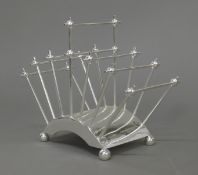 A Christopher Dresser style silver plated toast rack. 17 cm high.
